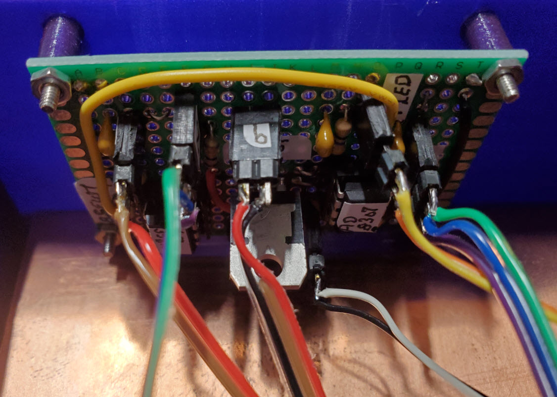 PCB mounted to inside back of enclosure